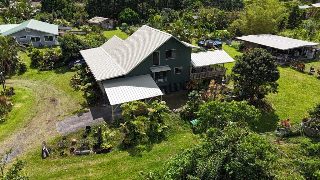 Roof Restoration and Green Exterior Painting in Keaau, Hawaii image