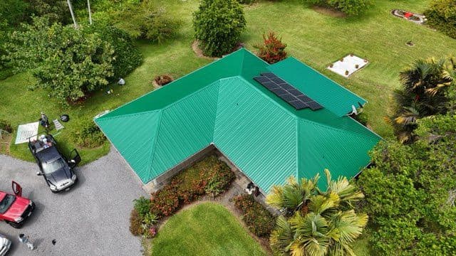Bright Green Metal Roof Overhaul in Hakalau Hawaii image